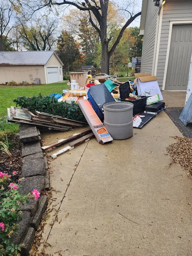 Dumpster being loaded with debris for Roofing Dumpster Rental in South Miami Heights